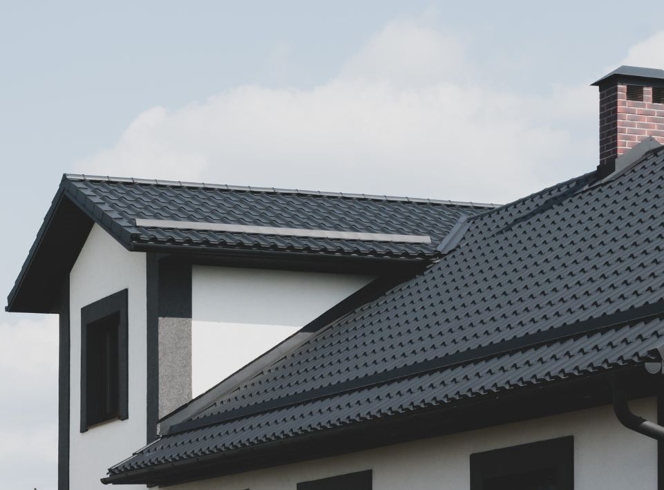 Dark tiled roof on a stylish residential home enhancing curb appeal